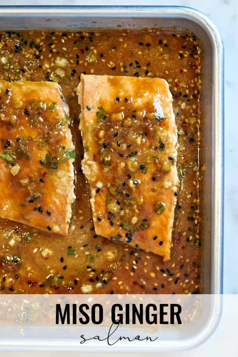 Salmon on a baking sheet with sauce.