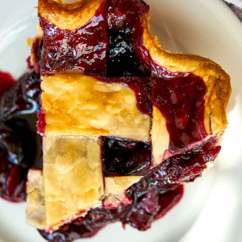 Top view of a slice of cherry pie.