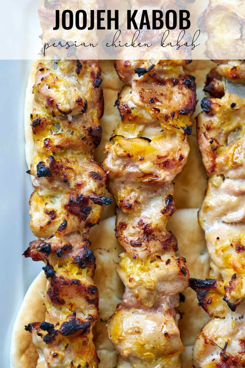 Three rows of chicken kabobs.