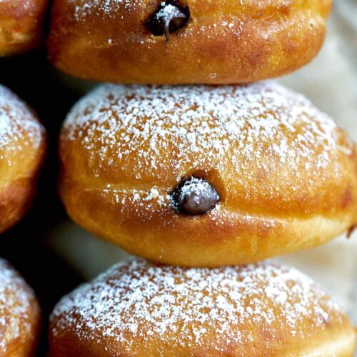 Stack of chocolate filled doughnuts.