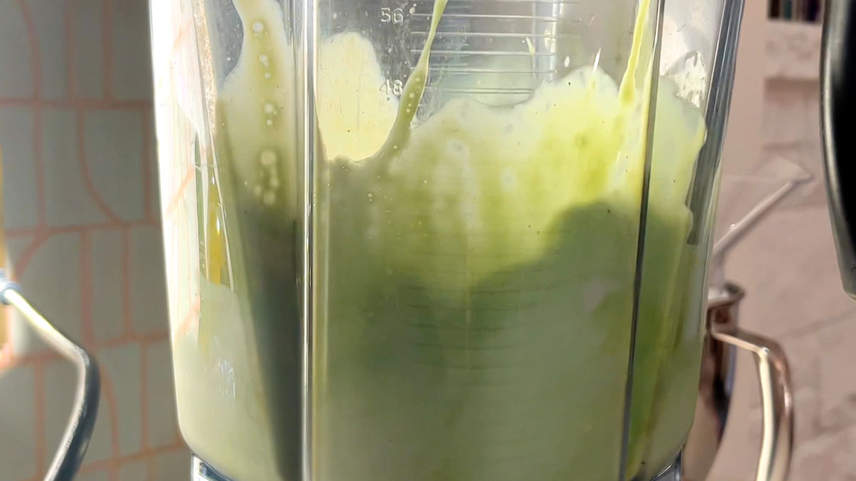 Green liquid in a blender.