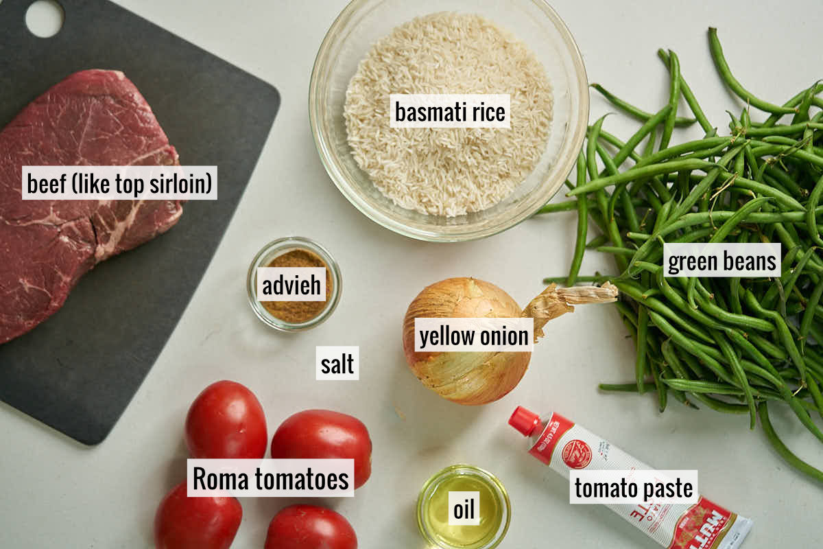 Meat, tomatoes, green beans, rice, and other labeled ingredients to make lubia polo.