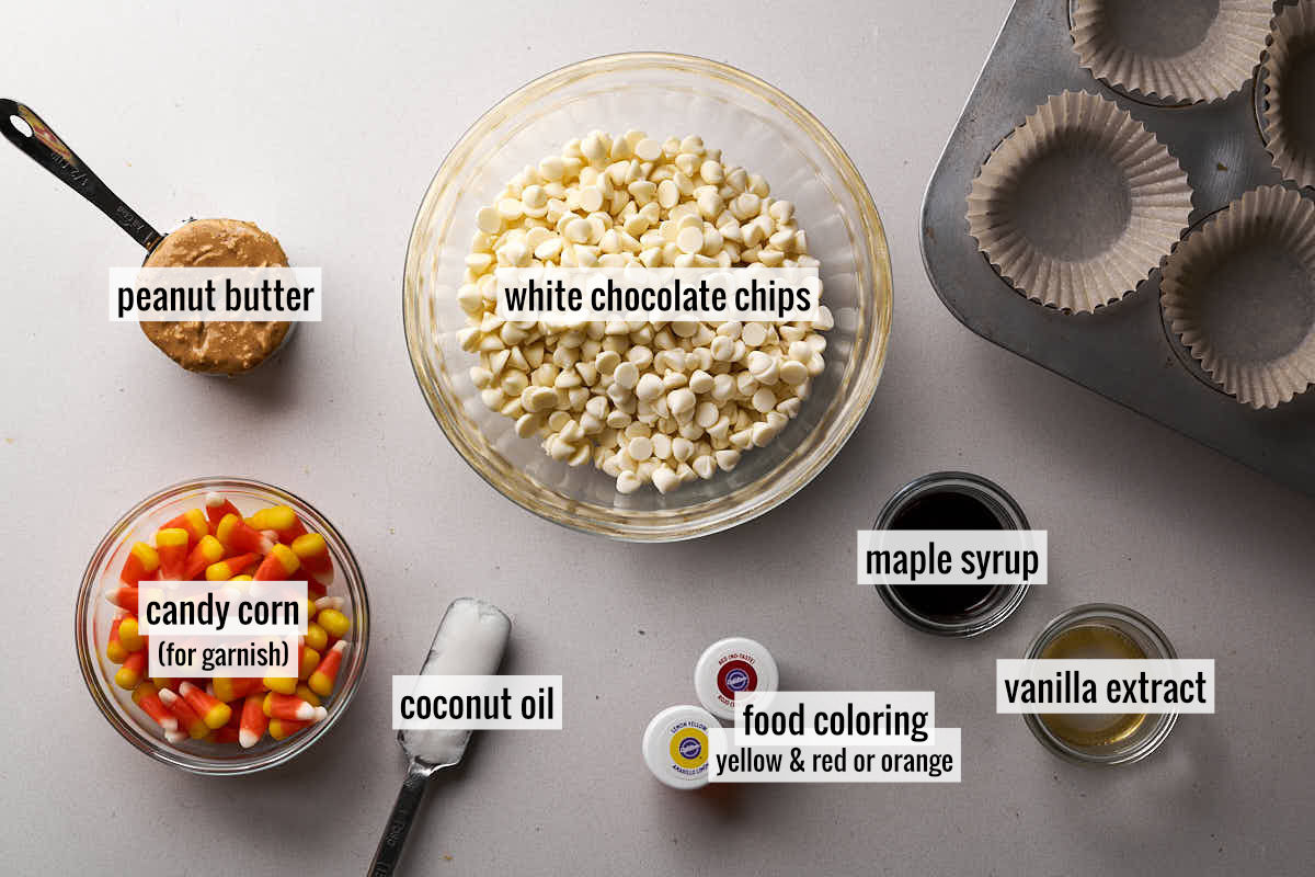 Ingredients to make candy corn peanut butter cups with white chocolate chips and candy corn.