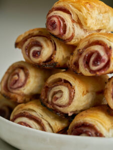 Flaky pastry rolls will jam stacked in a pyramid.