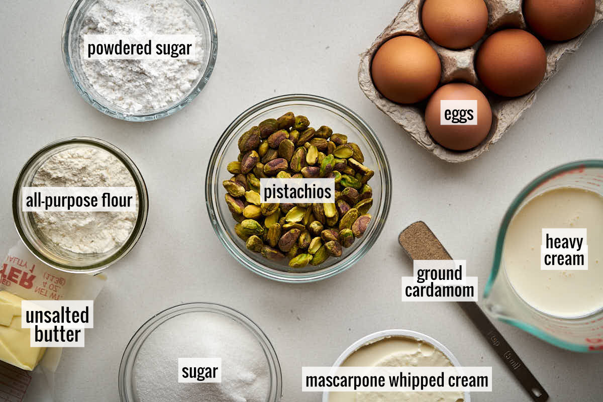 Pistachios, eggs in an egg carton, and other labeled ingredients to make this recipe on a countertop.