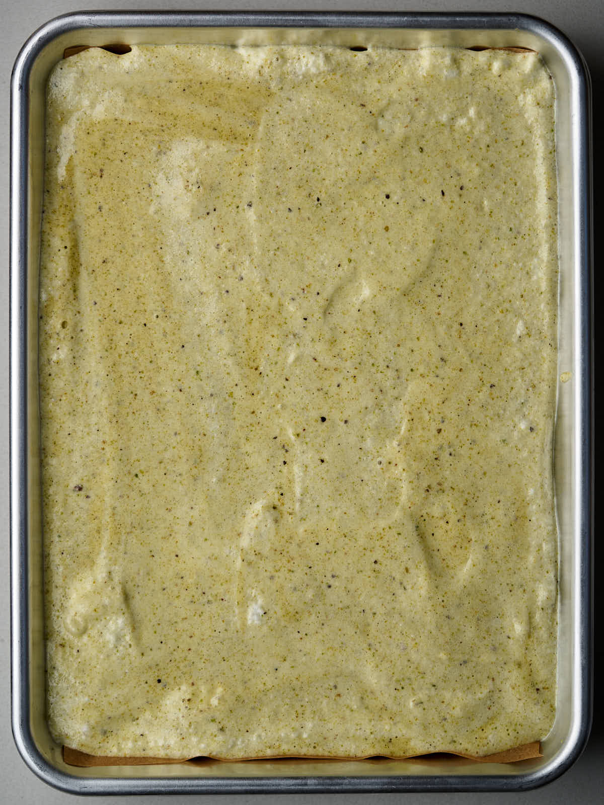 Green batter in a quarter sheet pan.