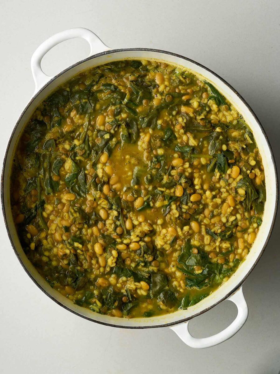 A large pot of yellow and green bean soup.