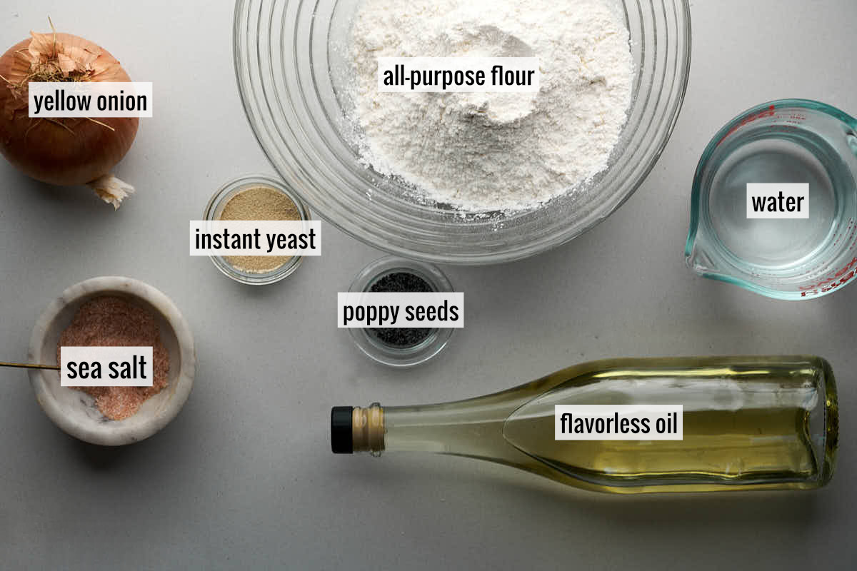 Ingredients to make bialys like flour, oil, an onion, and water.