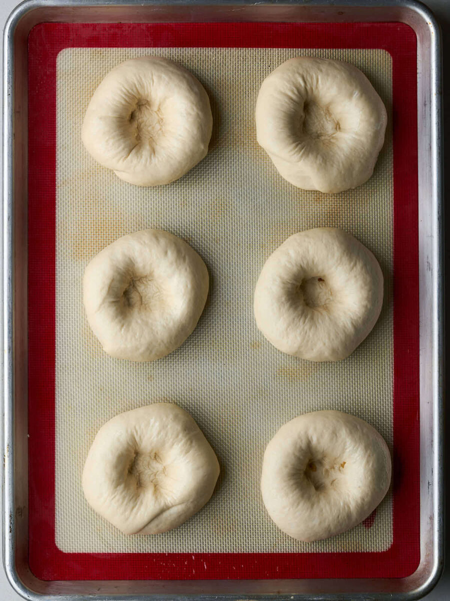 Discs of dough on a silicone lined baking sheet.