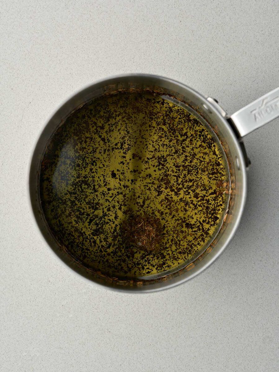 Olive oil and dried mint in a small saucepan.