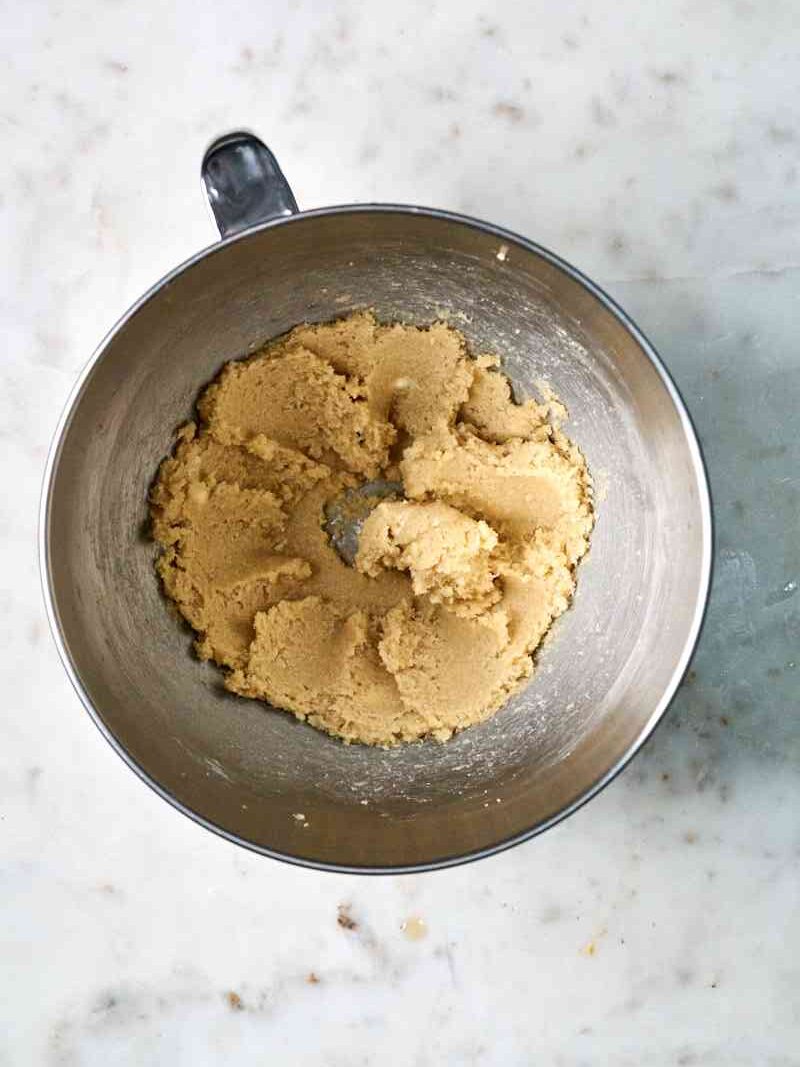 Butter and sugar creamed in a mixing bowl.