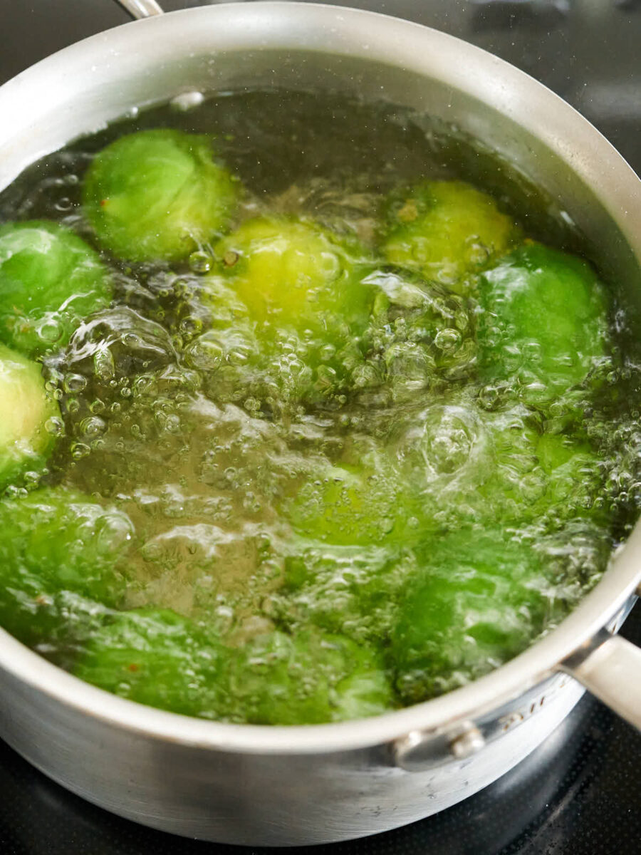 Limes in a pot of boiling water.