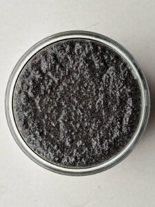 Top view of poppyseed filling in a glass jar.