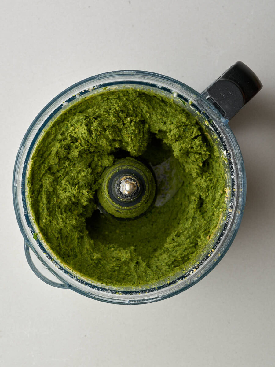 Blended green mix in a food processor.